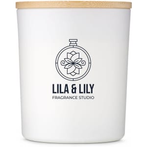 A large white glass candle with a wooden lid and a logo, featuring a floral design.