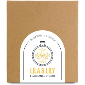 A large brown box with a circular label featuring a floral design and branding for "Lila & Lily Fragrance Studio."