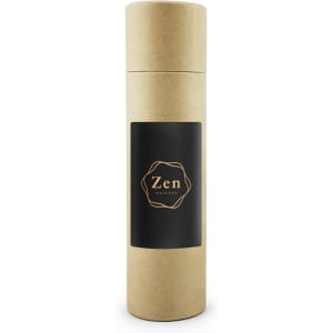 A cylindrical, brown cardboard container with a black label featuring a logo. It is for a vanilla reed diffuser.