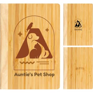 A bamboo notebook featuring a pet-themed design and a logo, with a natural wood finish.