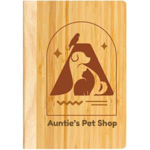 A bamboo notebook featuring a pet-themed design and a logo, showcasing a warm, natural wood color.