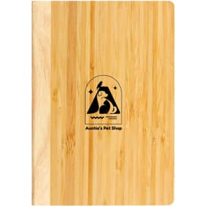 A bamboo notebook featuring a wooden cover and a logo on the front. It's sleek and eco-friendly in design.