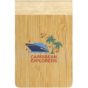 A bamboo notebook with a natural finish, featuring a logo and tropical design with palm trees and a boat.