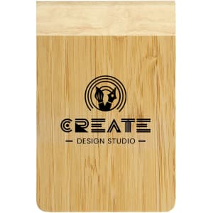 A bamboo notebook featuring a natural wood finish and a printed logo that reads "CREATE DESIGN STUDIO."