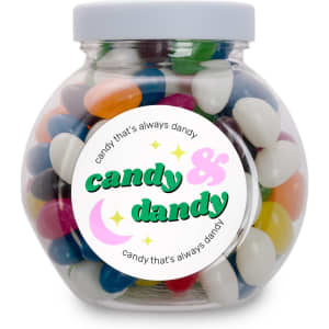 A glass jar filled with assorted colored mini jelly beans, featuring a label that says "candy that's always dandy."