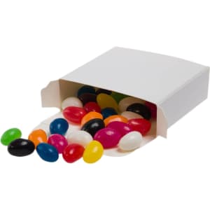 Assorted jelly beans in various colors spilling from a white box.