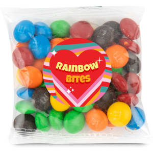 A 50 gram cello bag contains colorful chocolate-coated candies labeled as "Rainbow Bites."