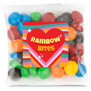 A 50-gram cello bag filled with colorful choc beans, branded as "Rainbow Bites."
