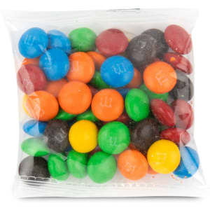 A clear cello bag filled with colorful M&M's in blue, green, red, orange, yellow, and black.