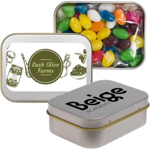 Assorted colour mini jelly beans in a silver rectangular tin with a logo and a design on the lid.