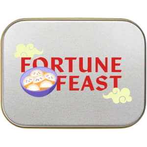 A silver rectangular tin labeled "FORTUNE FEAST," featuring a bowl of dumplings and decorative elements.