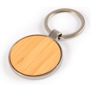 A circular bamboo and zinc keytag featuring a smooth bamboo surface and a metal keyring attachment.