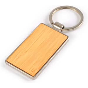 A rectangular bamboo keytag with a zinc metal keyring, featuring a smooth wooden surface.