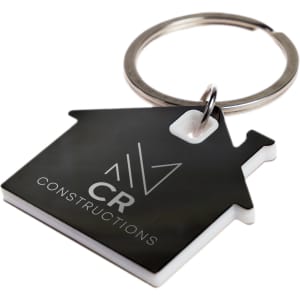 A keytag shaped like a house in black and white, featuring a circular keyring and a logo.