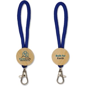 A keytag with a wooden circular base, featuring a logo and attached to a blue braided lanyard.