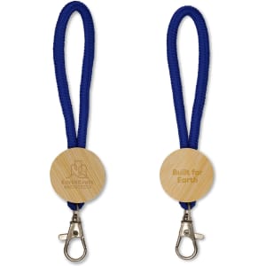 A blue keytag with a looped rope design and a wooden circular attachment featuring an engraved logo.
