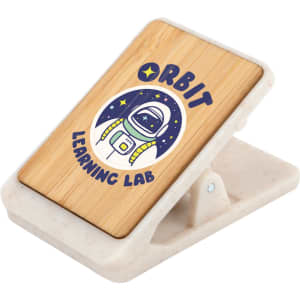 A bamboo phone stand with a white base and an illustration of an astronaut, featuring a logo.