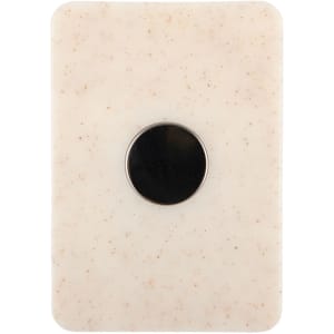 A creamy white magnetic clip with a circular black centre and a smooth, textured surface.