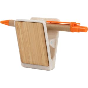 A magnetic clip holder in white with a bamboo back and an orange pen attached. Includes a space for notes.