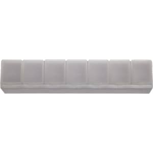 A weekly pill box in clear plastic with eight compartments labeled for each day of the week.