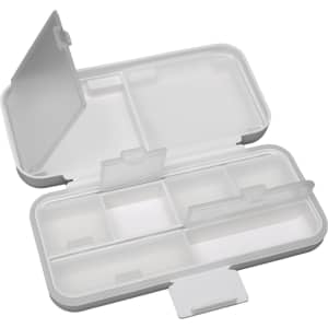 A compact pill organizer in white with multiple compartments and clear lids for easy access to contents.