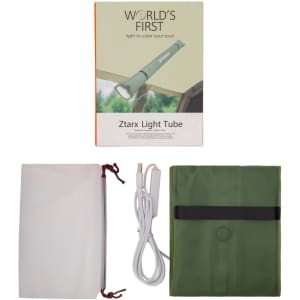 A foldable camp light in green with a USB charging cable, packaged with a box and a transparent cover.