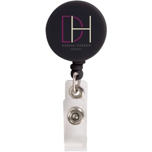 A retractable name badge holder in black with a clear strap and a circular logo attachment.