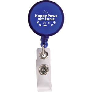 A retractable name badge holder in blue with the text "Happy Paws VET CLINIC" and paw print designs.
