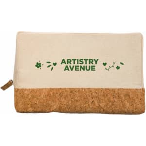 A utility case featuring a cream fabric body and a cork base, with green floral designs and branding.