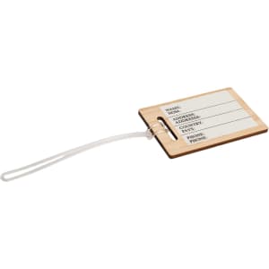 A bamboo luggage tag with space for name, address, email, and phone number, attached with a clear strap.