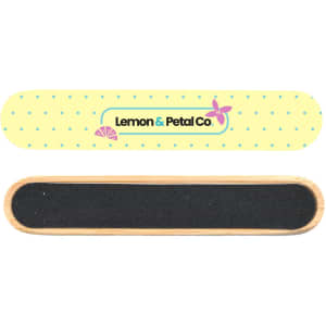A bamboo nail file with a yellow and white polka dot design and a black filing surface. It features a logo.