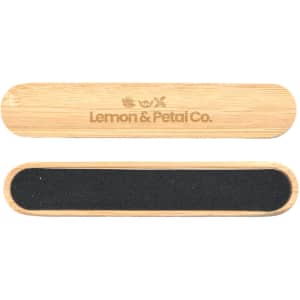 A bamboo nail file with a black sanding surface and branding on the top.