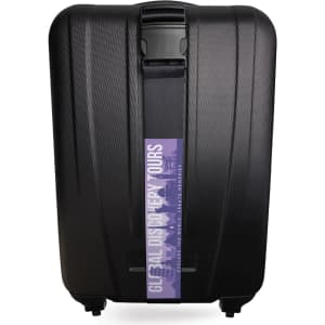 A black hard-shell suitcase with a luggage strap featuring a logo across the front.