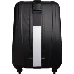 A black suitcase featuring a luggage strap across its surface for secure fastening.