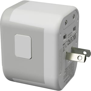 A travel adaptor in white with a compact design and a folding plug. It features multiple ports on one side.