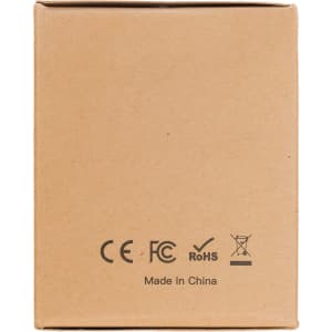 A travel adaptor packaged in a plain cardboard box, featuring certification marks and the text "Made in China."