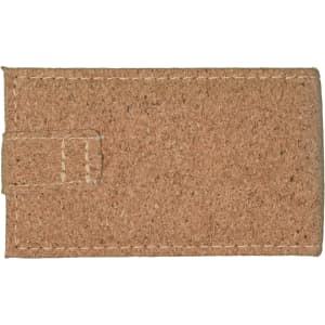 A Cork Manicure Set packaged in a natural cork case, featuring a textured surface and secured with a flap closure.