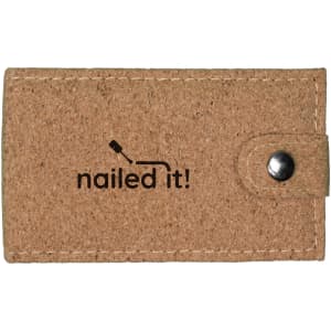 A cork manicure set in a beige case with a button closure and a logo printed on the front.