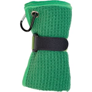 A green Rhino Travel Towel wrapped and secured with a black strap, featuring a carabiner for attachment.