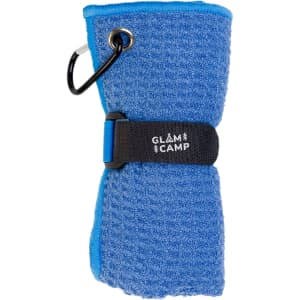 A blue travel towel neatly rolled and secured with a strap, featuring a clip for easy attachment.
