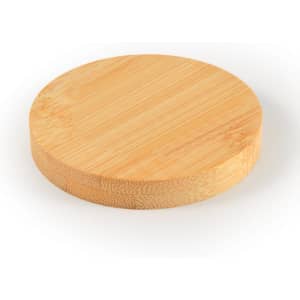 A Discus Bamboo Bottle Opener Coaster, featuring a smooth, round design made from natural bamboo.