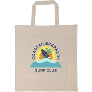A beige tote bag with a logo featuring surfboards, palm trees, and waves in blue and yellow tones.