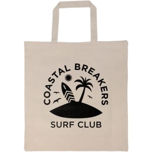 A cream-colored tote bag with a black logo featuring a palm tree, surfboard, and birds. It has short handles.