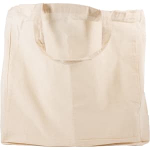 A cream-colored reusable calico bag with a short handle and no visible text or logos.