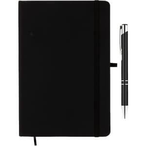 A black notebook with an elastic band and a silver Napier pen positioned beside it. The notebook has a logo.