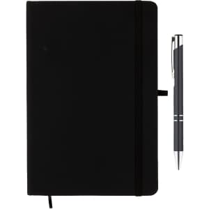 A black notebook with a pen beside it, featuring a logo on the cover. The notebook has an elastic band closure.