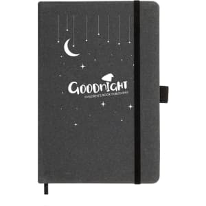 A black recycled leather notebook with a moon and star design, featuring an elastic closure and a logo.