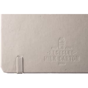 A recycled milk carton notebook with a textured grey cover and elastic band closure. It features branding on the back.