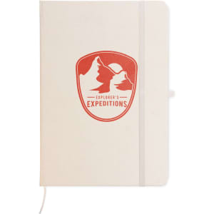 A cream-colored A5 notebook with a red logo featuring mountains on the front cover and an elastic band closure.