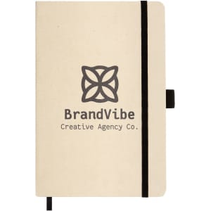 A beige A5 notebook featuring a black elastic band and a logo on the cover. Includes a ribbon bookmark.